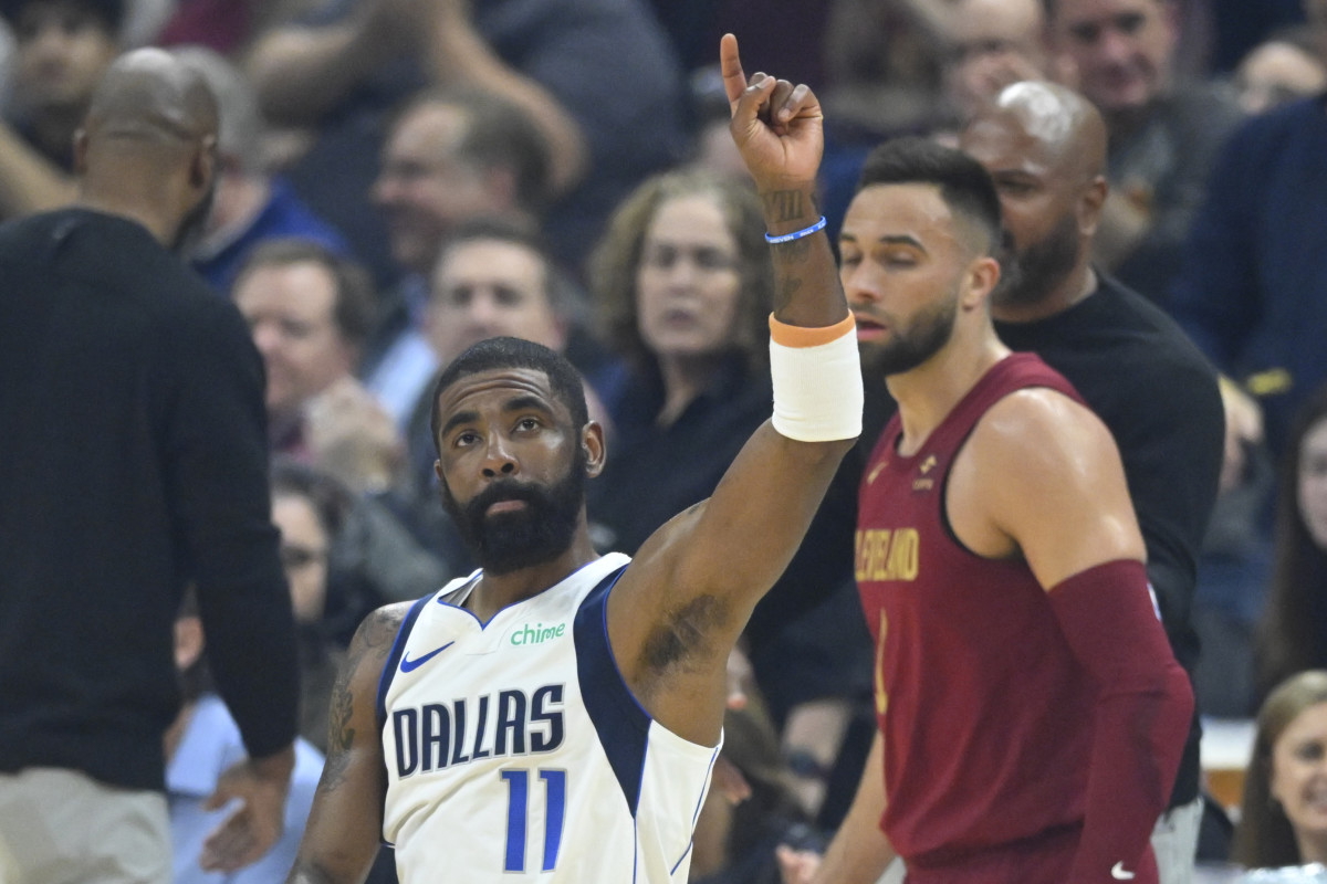 Feb 27, 2024; Cleveland, Ohio, USA; Dallas Mavericks guard Kyrie Irving (11) reacts to fans in the first quarter against the Cleveland Cavaliers at Rocket Mortgage FieldHouse.