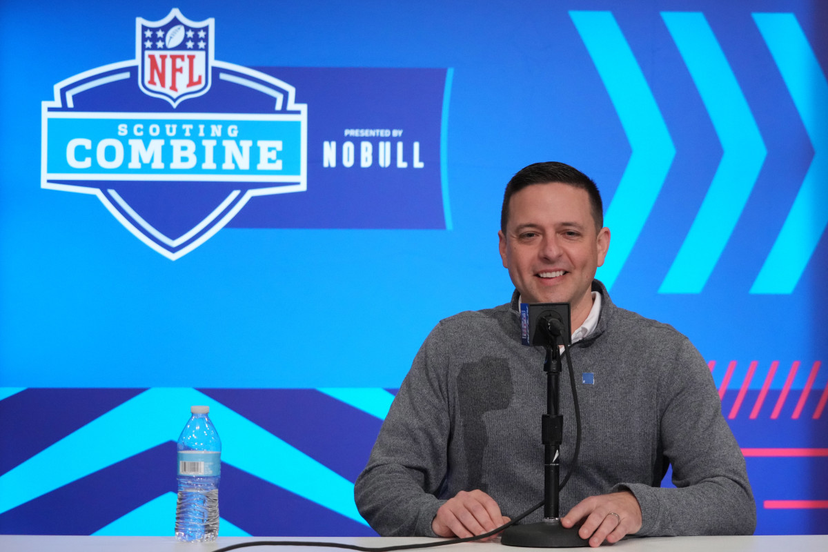 Eliot Wolf sits talking into a microphone at the NFL scouting combine