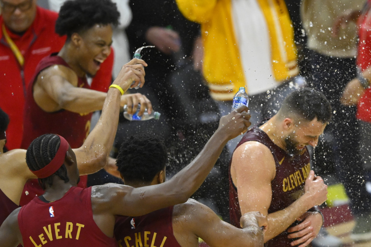 Feb 27, 2024; Cleveland, Ohio, USA; Cleveland Cavaliers guard Max Strus (1) is doused with water after hitting a last-second, game-winning three-point basket in the fourth quarter against the Dallas Mavericks at Rocket Mortgage FieldHouse.