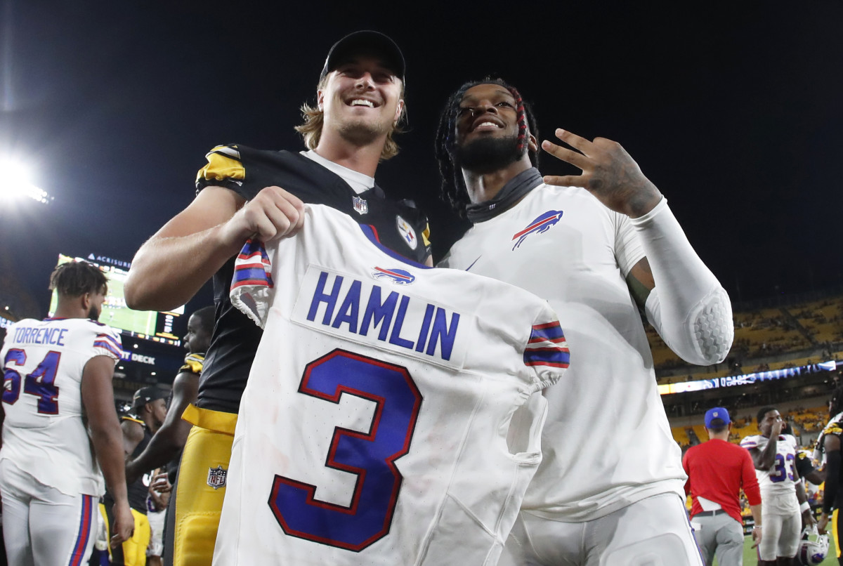Pittsburgh Steelers quarterback Kenny Pickett (left) and Buffalo Bills safety Damar Hamlin (right) pose for a photo after Hamlin gifted his game jersey to Pickett