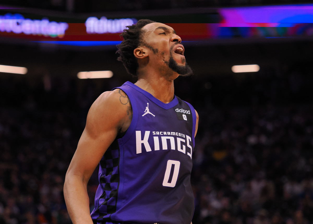 Feb 9, 2024; Sacramento, California, USA; Sacramento Kings guard Malik Monk (0) reacts after missing a shot against the Denver Nuggets during the fourth quarter at Golden 1 Center. Mandatory Credit: Kelley L Cox-USA TODAY Sports