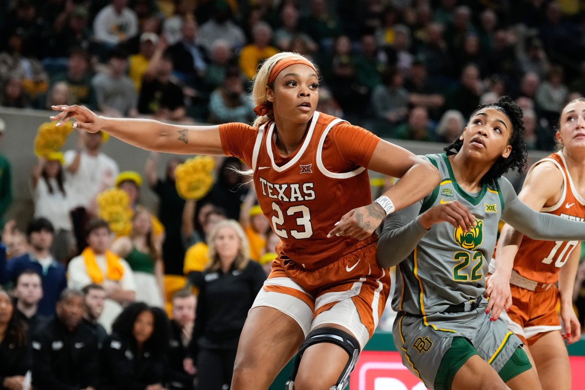Feb 1, 2024; Waco, Texas, USA; Texas Longhorns forward Aaliyah Moore (23) and Baylor Lady Bears guard Bella Fontleroy (22) battle for position during the second half at Paul and Alejandra Foster Pavilion. 