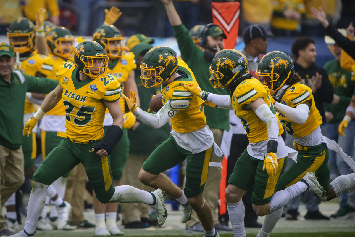 Jan 8, 2022; Frisco, TX, USA; The North Dakota State Bison celebrate an interception by safety Dawson Weber (2) against the Montana State Bobcats during the first half of the FCS Championship at Toyota Stadium.