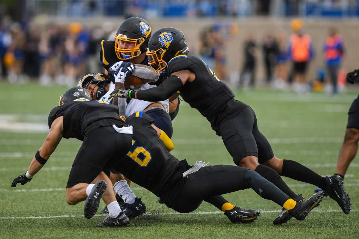 South Dakota State football players try to tackle a Montana State player at Dana J. Dykhouse Stadium in Brookings, South Dakota on Saturday, Sept. 9, 2023.