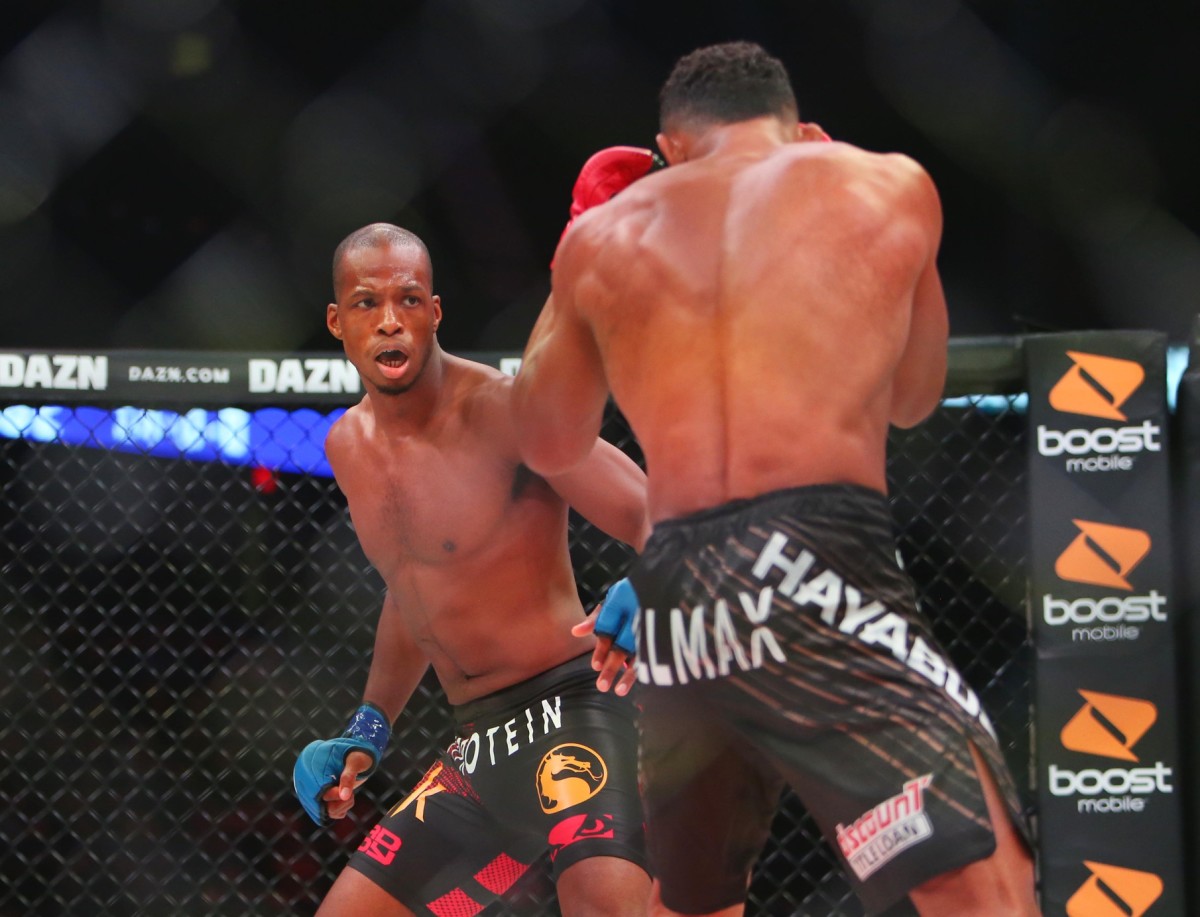Douglas Lima (red gloves) and Michael Page (blue gloves) during Bellator 221