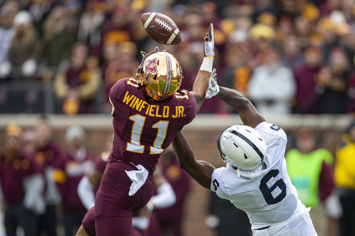 Nov 9, 2019; Minneapolis, MN, USA; Minnesota Golden Gophers defensive back Antoine Winfield Jr. (11) intercepts a pass intended for Minnesota Golden Gophers wide receiver Tyler Johnson (6) in the first quarter at TCF Bank Stadium.