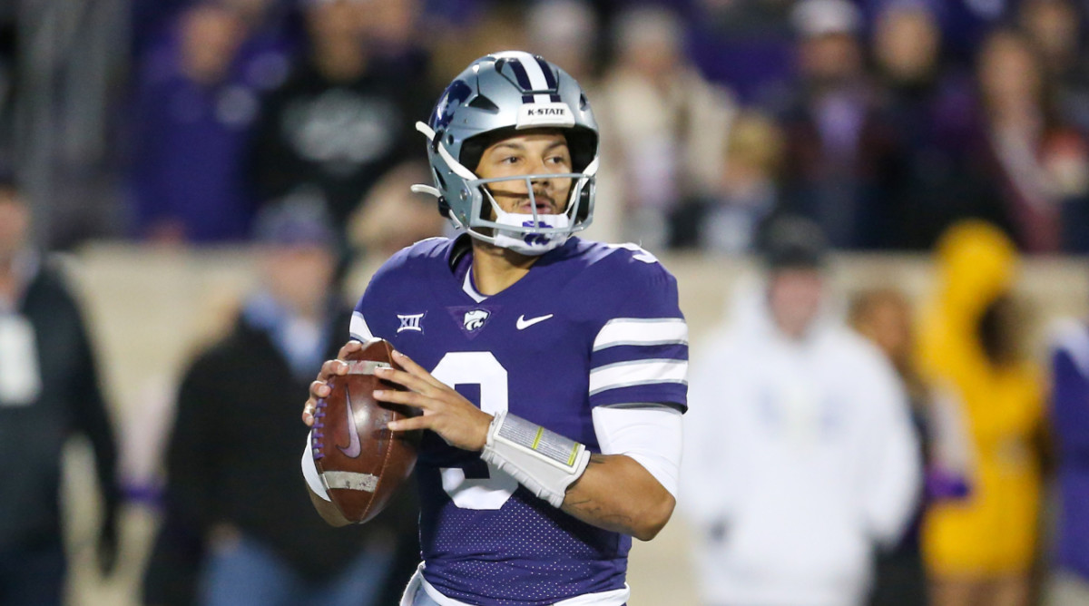 Kansas State quarterback Adrian Martinez sets to pass.
