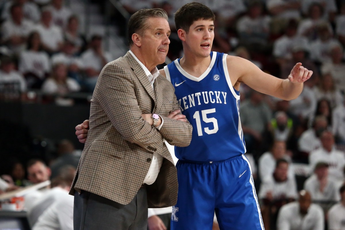 Kentucky Wildcats guard Reed Sheppard (15) talks with head coach John Calipari (left) during the second half against the Mississippi State Bulldogs at Humphrey Coliseum in Starkville, Mississippi, on Feb. 27, 2024.