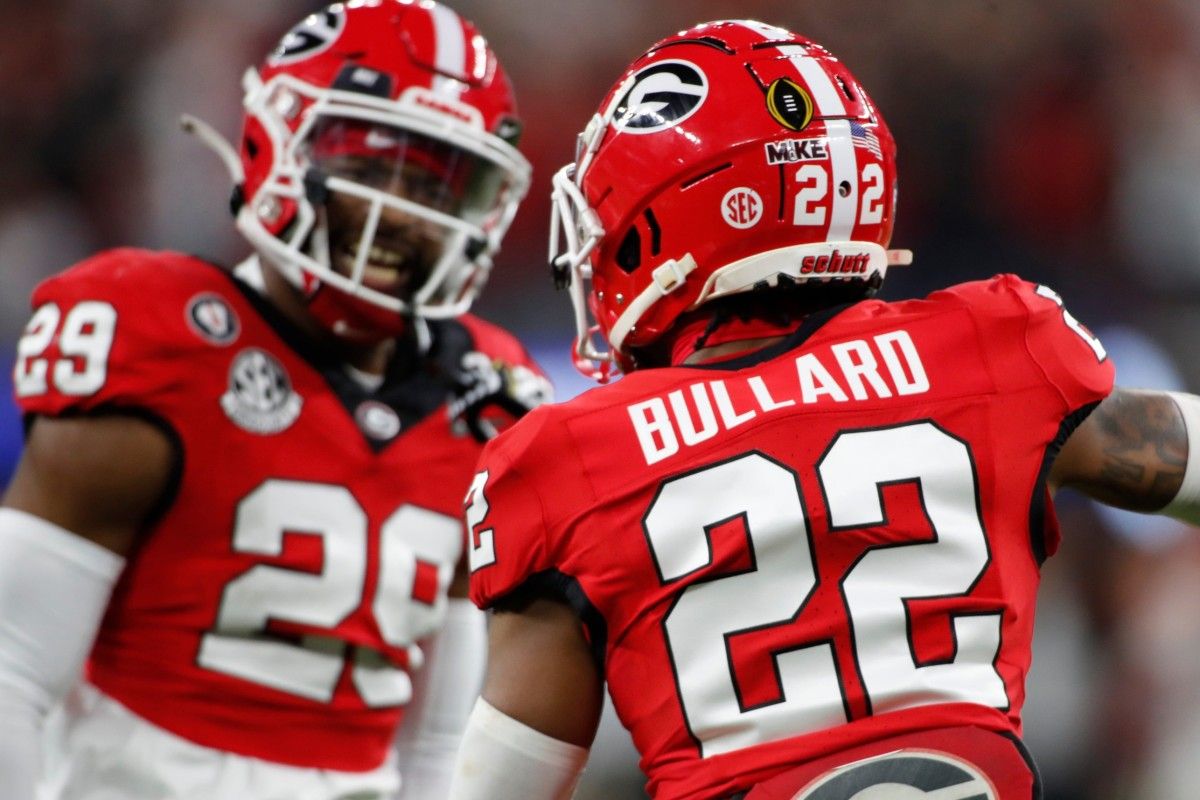 Las Vegas Raiders S Christopher Smith II (left) and safety prospect Javon Bullard (right) were teammates at Georgia.