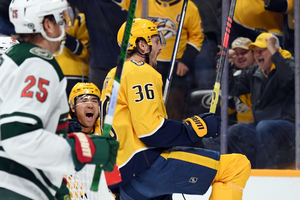 Feb 29, 2024; Nashville, Tennessee, USA; Nashville Predators left wing Cole Smith (36) celebrates after a goal during the first period against the Minnesota Wild at Bridgestone Arena.