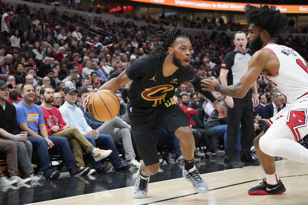 Feb 28, 2024; Chicago, Illinois, USA; Cleveland Cavaliers guard Darius Garland (10) is defended by Chicago Bulls guard Coby White (0) during the second half at United Center.