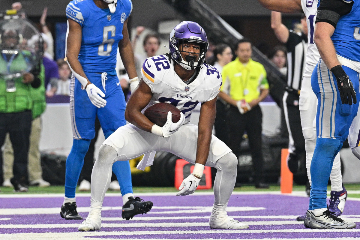 Dec 24, 2023; Minneapolis, Minnesota, USA; Minnesota Vikings running back Ty Chandler (32) reacts after scoring a touchdown against the Detroit Lions during the game at U.S. Bank Stadium.