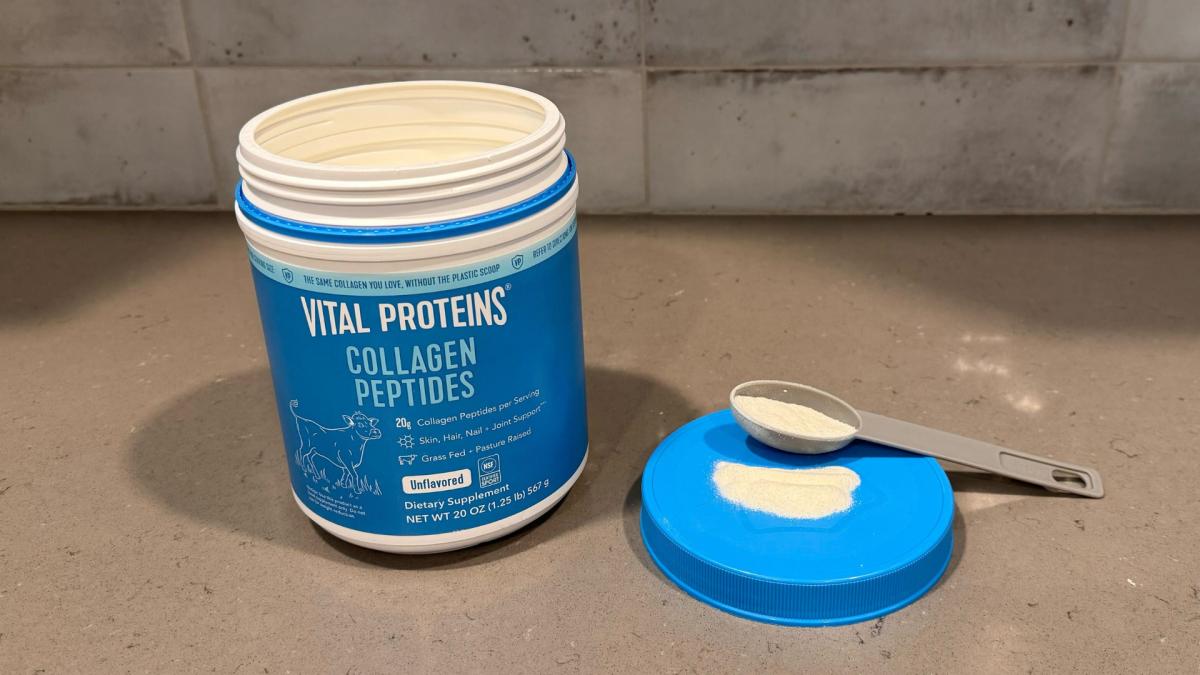A blue tub of unflavored Vital Proteins Collagen Peptides on a kitchen counter