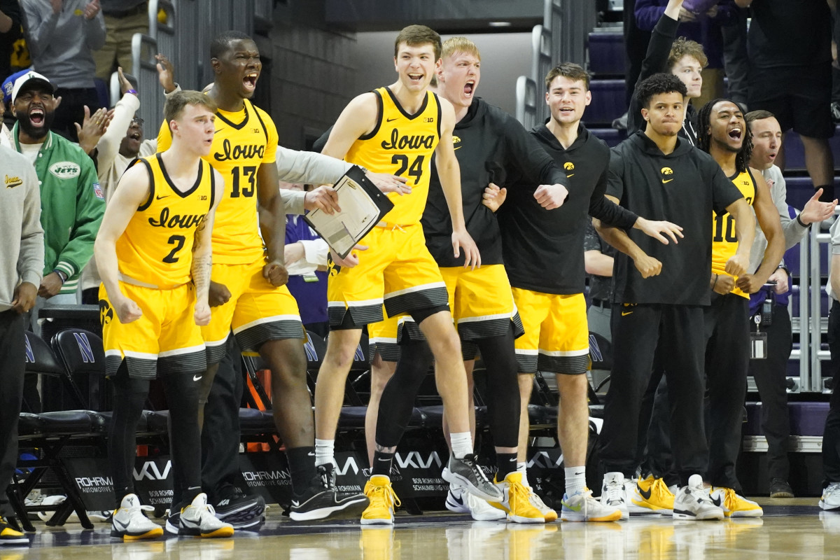 The Iowa Hawkeyes bench celebrates a basket against the Northwestern Wildcats during the second half at Welsh-Ryan Arena on Mar 2, 2024 in Evanston, Ill. (David Banks-USA TODAY Sports)
