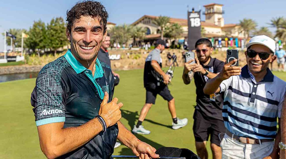 Joaquin Niemann of Chile smiles on the 18th green after winning the 2024 LIV Golf Jeddah tournament.