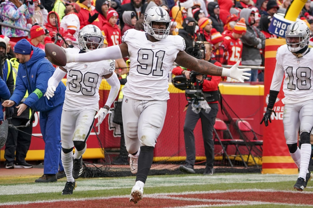 Dec 25, 2023; Kansas City, Missouri, USA; Las Vegas Raiders defensive tackle Bilal Nichols (91) celebrates after recovering a fumble to score against the Kansas City Chiefs during the game at GEHA Field at Arrowhead Stadium.