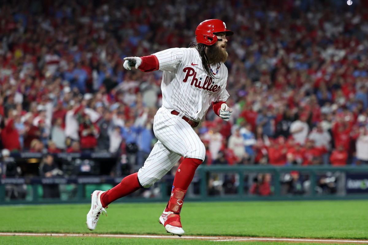 Oct 24, 2023; Philadelphia, Pennsylvania, USA; Philadelphia Phillies center fielder Brandon Marsh (16) reacts after hitting a single in the third inning for game seven of the NLCS for the 2023 MLB playoffs at Citizens Bank Park.