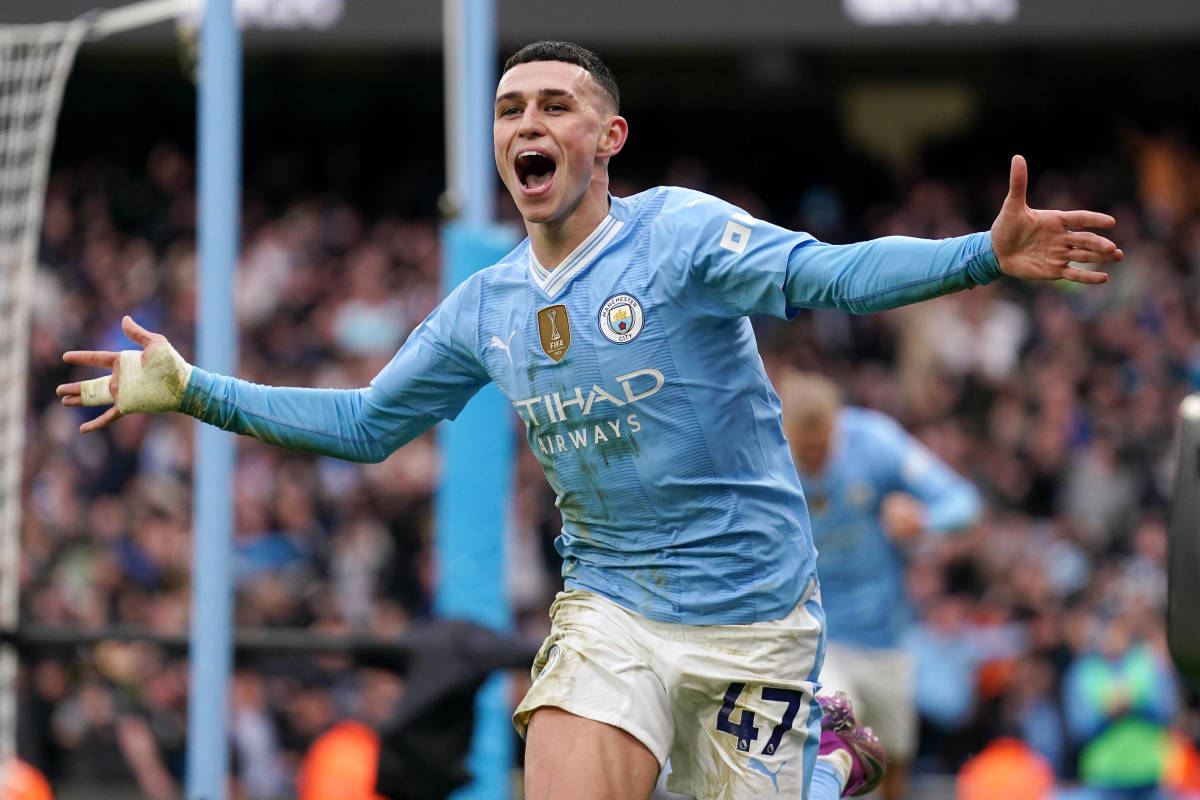 Phil Foden pictured celebrating after scoring two goals for Manchester City in a 3-1 win over Manchester United in March 2024
