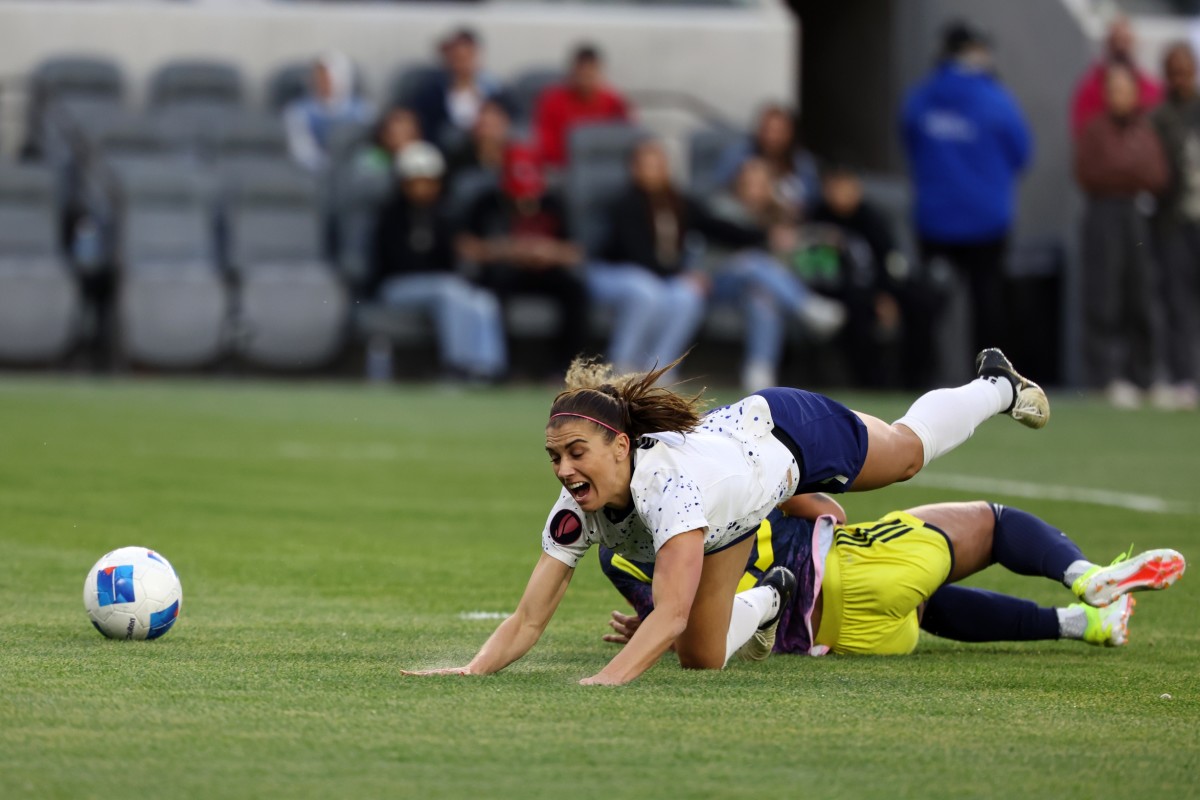 Alex Morgan gets pulled down, resulting in a penalty. Photo by Kiyoshi Mio, USA TODAY Sports