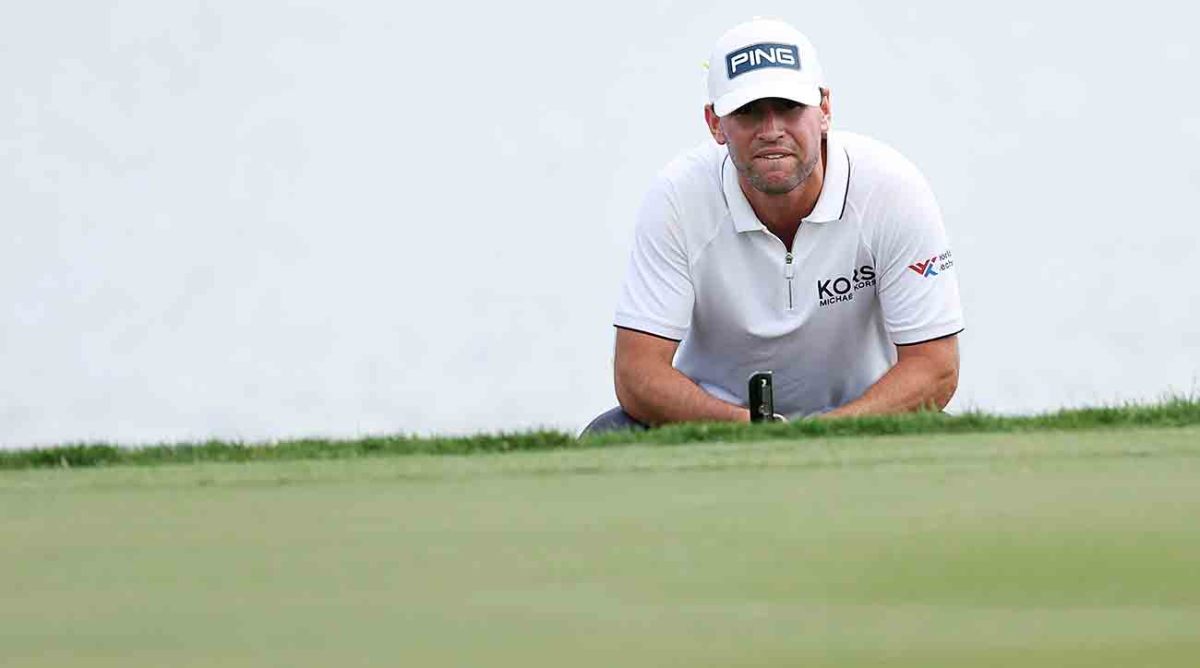 Austin Eckroat lines up a putt on the 14th green during the continuation of the weather delayed final round of the 2024 Cognizant Classic in The Palm Beaches at PGA National Resort in Palm Beach Gardens, Fla.