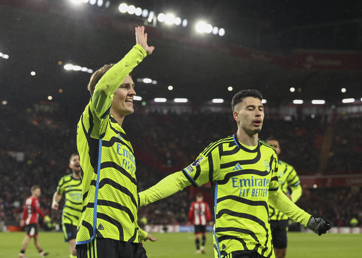 Martin Odegaard (left) and Gabriel Martinelli pictured celebrating a goal during Arsenal's 6-0 win at Sheffield United in March 2024