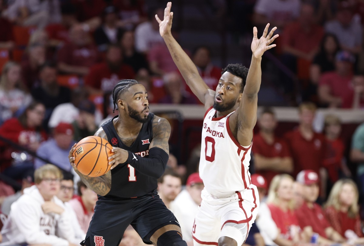 Mar 2, 2024; Norman, Oklahoma, USA; Oklahoma Sooners guard Le'Tre Darthard (0) defends a pass by Houston Cougars guard Jamal Shead (1) during the second half at Lloyd Noble Center. 