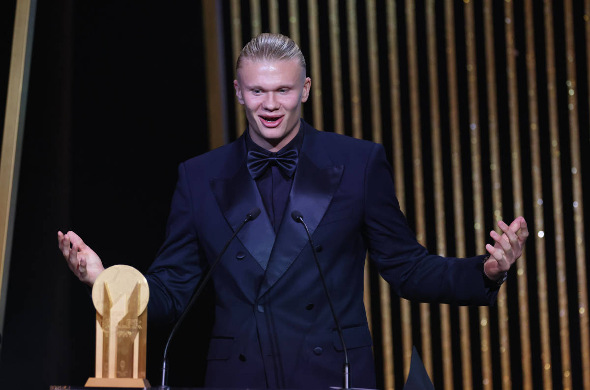 Erling Haaland pictured speaking on stage at the 2023 Ballon d'Or awards ceremony, where he was beaten to the main prize by Lionel Messi but received the Gerd Muller Trophy for being the Striker of the Year