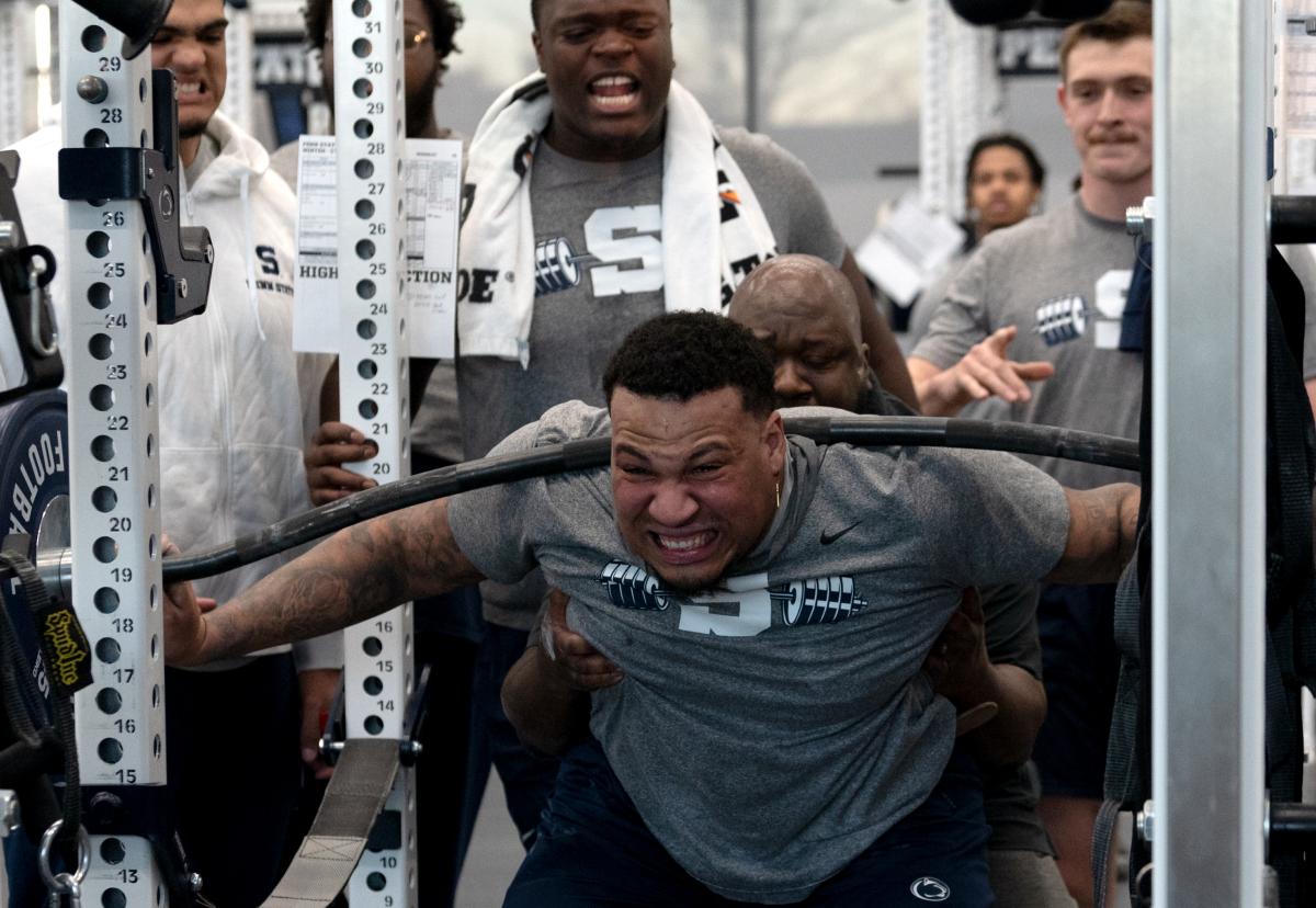 Penn State center Nick Dawkins goes through a lifting drill during the Nittany Lions' max-out session at the Lasch Football Building.