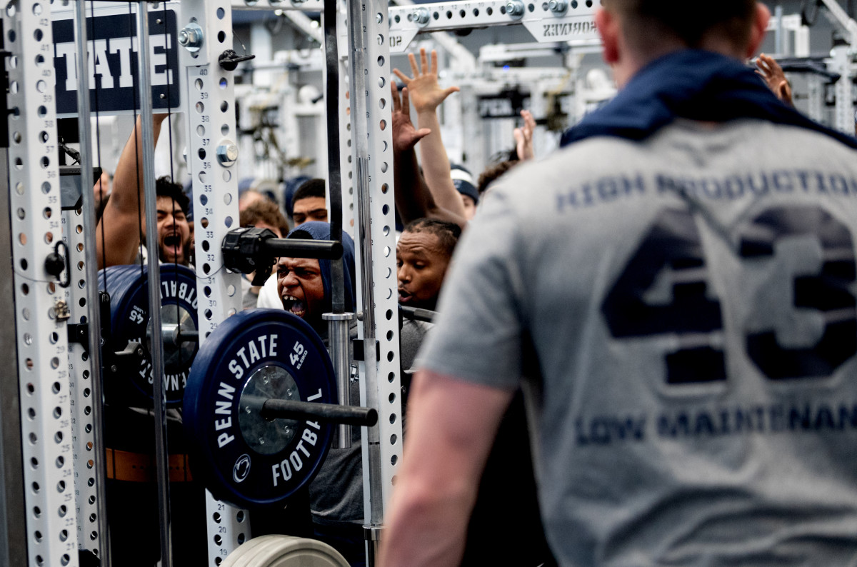 Penn State offensive lineman Sal Wormley is cheered by teammates during a max-out lifting session at the Lasch Football Building.