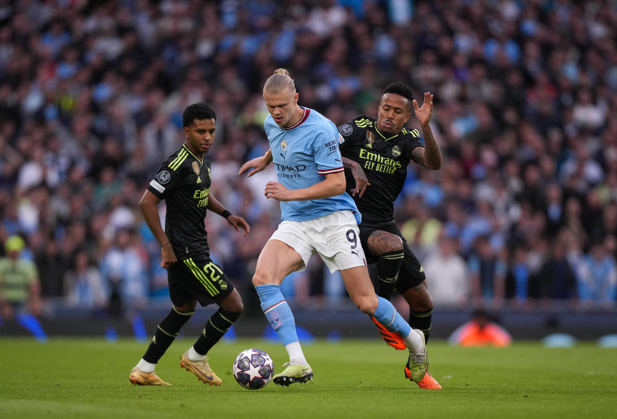 Erling Haaland pictured (center) playing for Manchester City against Real Madrid in the semi-finals of the UEFA Champions League in May 2023