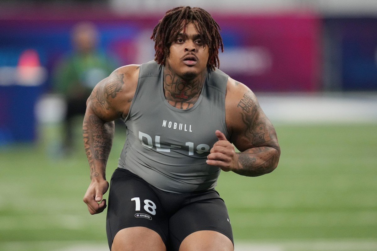 Feb 29, 2024; Indianapolis, IN, USA; Texas defensive lineman Byron Murphy (DL18) works out during the 2024 NFL Combine at Lucas Oil Stadium.