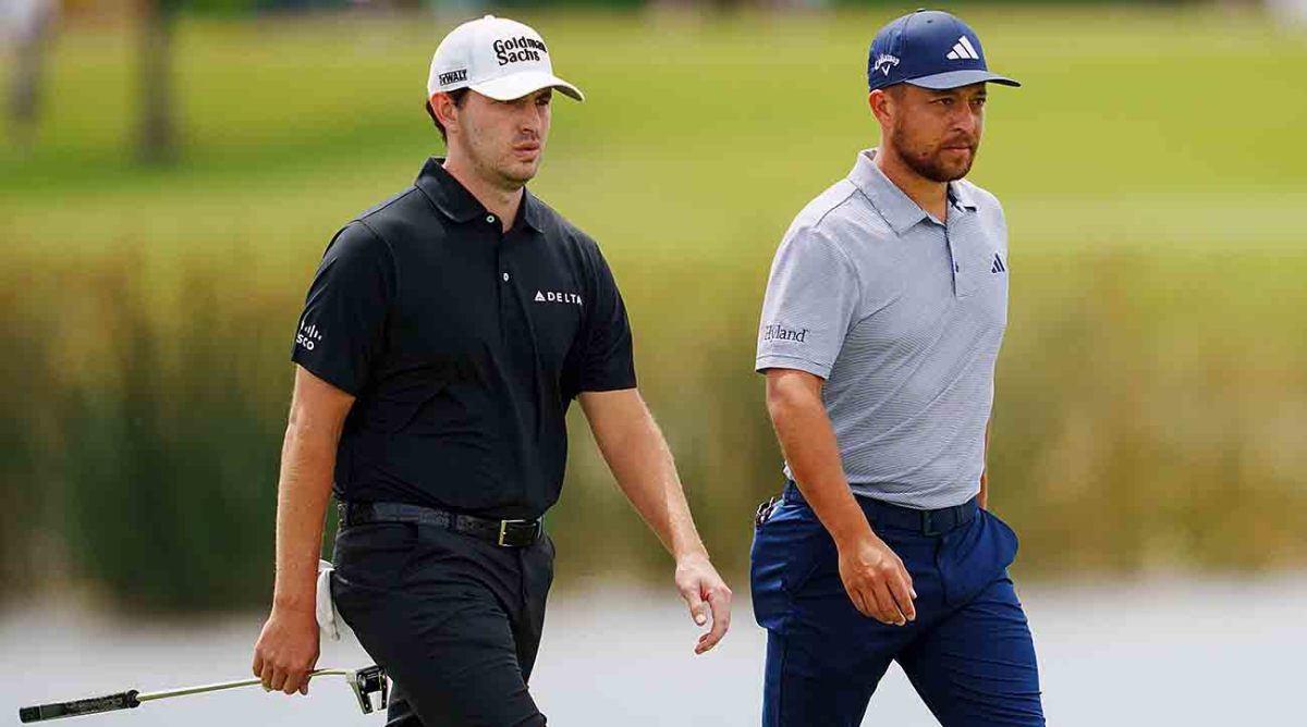 Patrick Cantlay and Xander Schauffele walk during the 2023 Zurich Classic of New Orleans.