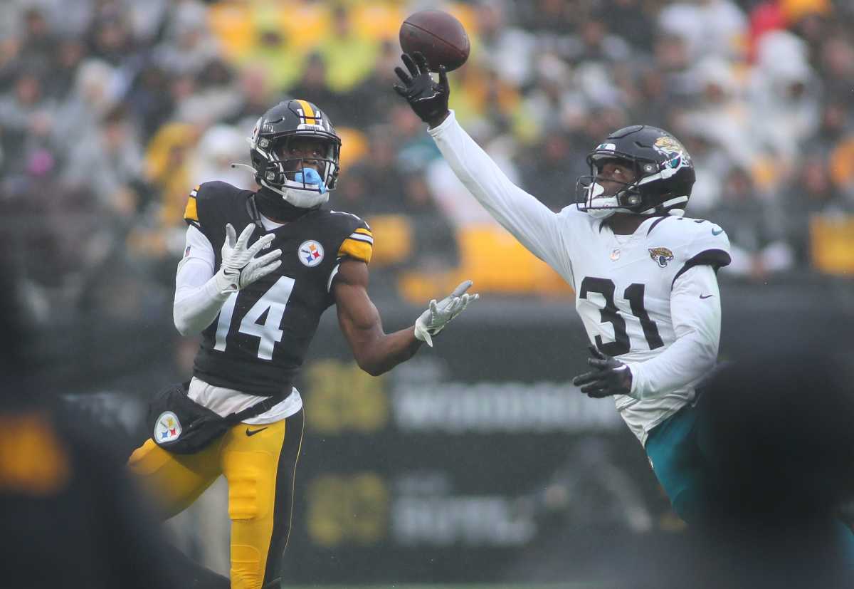 Jacksonville Jaguars Darious Williams (31) tips away a pass intended for Pittsburgh Steelers George Pickens (14) during the first half at Acrisure Stadium in Pittsburgh, PA on October 29, 2023.