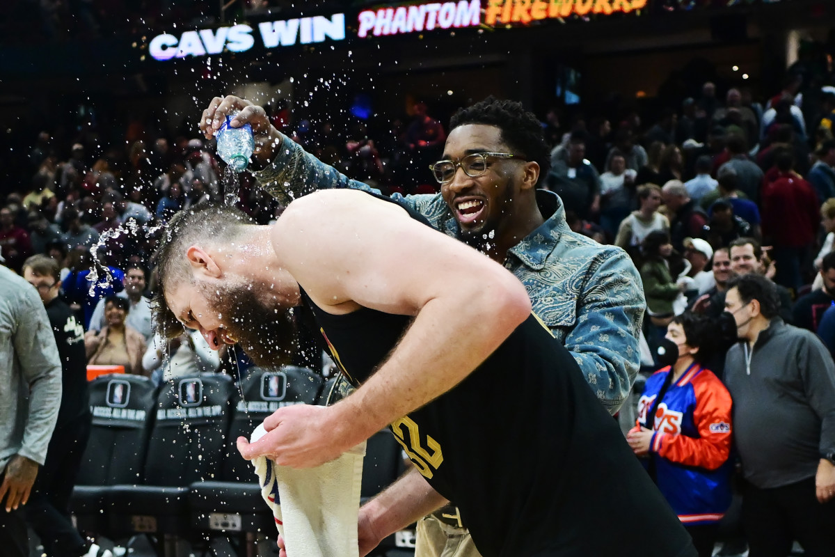Mar 5, 2024; Cleveland, Ohio, USA; Cleveland Cavaliers guard Donovan Mitchell pours water on forward Dean Wade (32) after the Cavaliers beat the Boston Celtics at Rocket Mortgage FieldHouse.