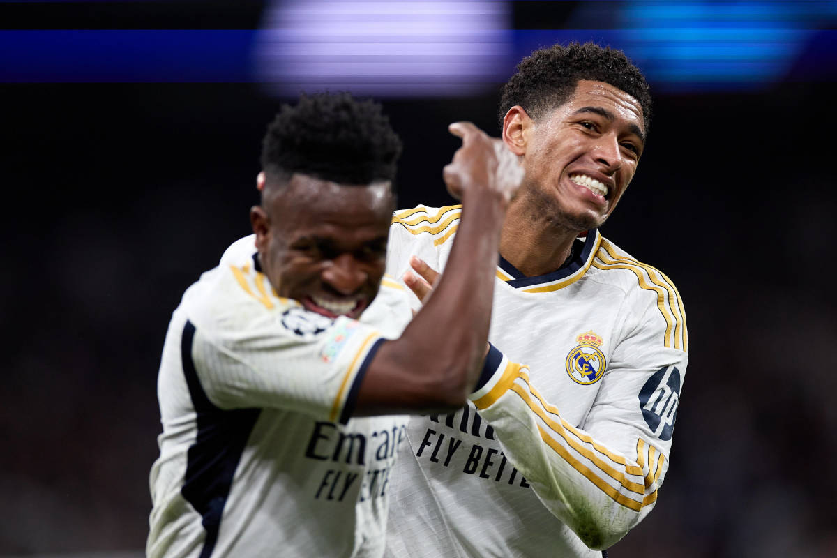 Vinicius Junior pictured (left) pointing at teammate Jude Bellingham while celebrating a goal during Real Madrid's 1-1 draw against RB Leipzig in March 2024