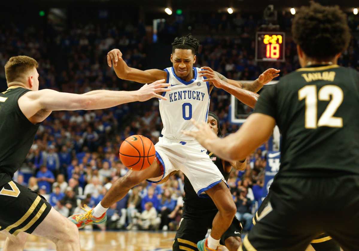 Kentucky's guard Rob Dillingham (0) gets fouled against Vanderbilt during the first half of an NCAA basketball game at Rupp Arena in Lexington, Ky., Wednesday, Mar. 6, 2024