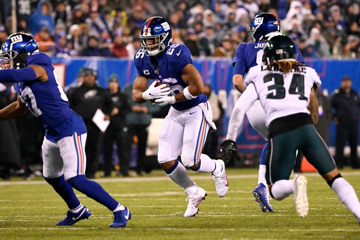 New York Giants running back Saquon Barkley (26) rushes against the Philadelphia Eagles in the first half of an NFL game on Sunday, Dec. 29, 2019, in East Rutherford. Nyg Vs Phi