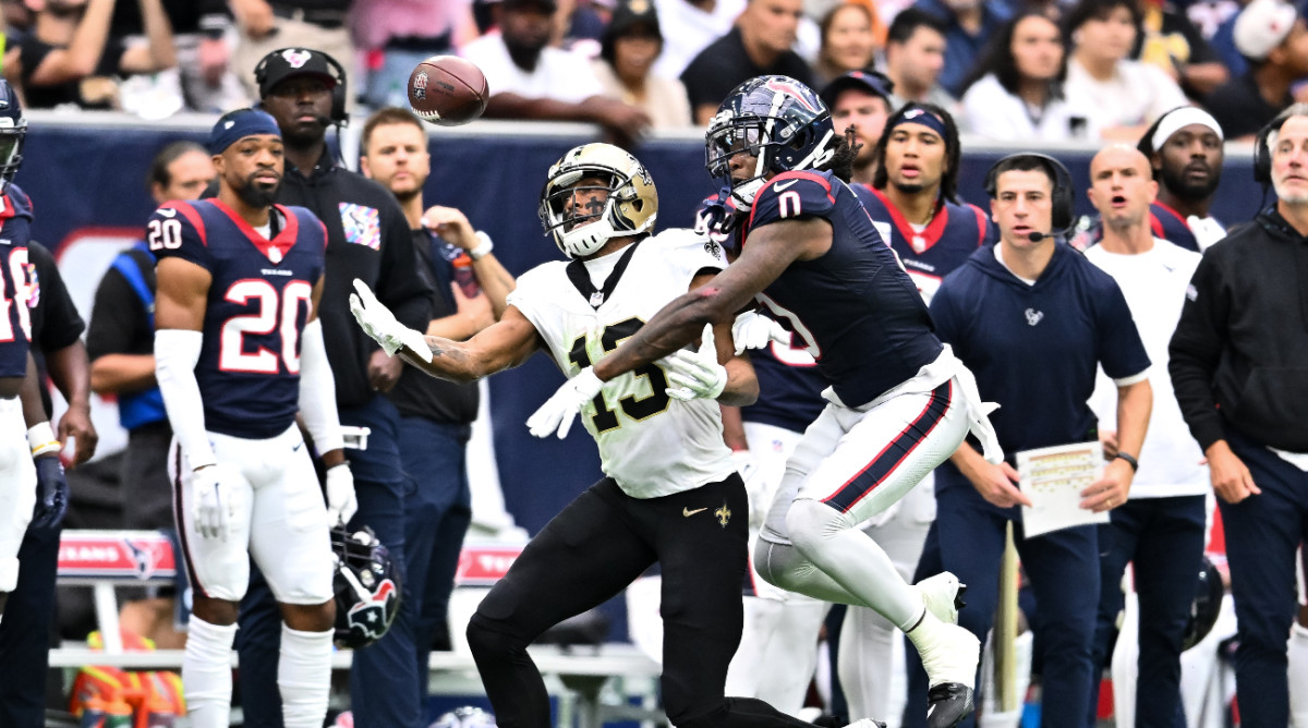 Oct 15, 2023; Houston, Texas, USA; Houston Texans cornerback Shaquill Griffin (0) breaks up a pass to New Orleans Saints wide receiver Michael Thomas (13) during the fourth quarter at NRG Stadium.