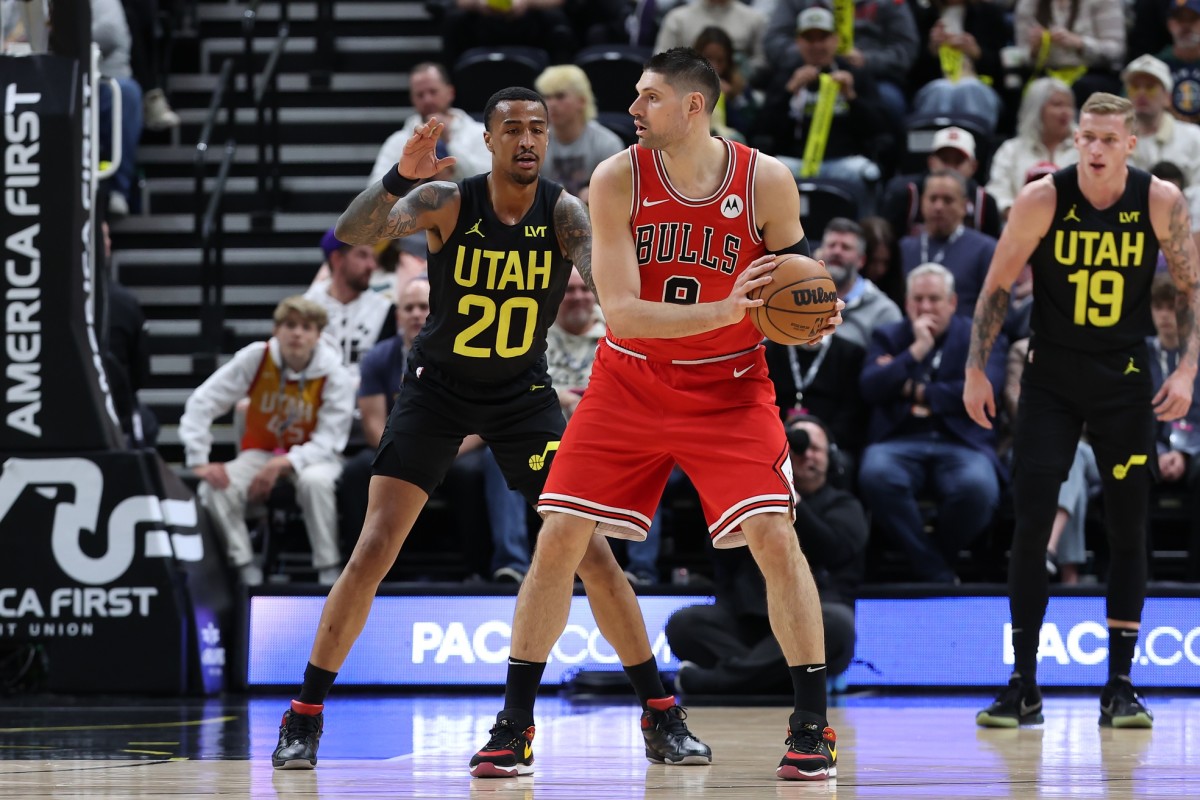 Chicago Bulls center Nikola Vucevic (9) posts up against Utah Jazz forward John Collins (20) during the first quarter at Delta Center.