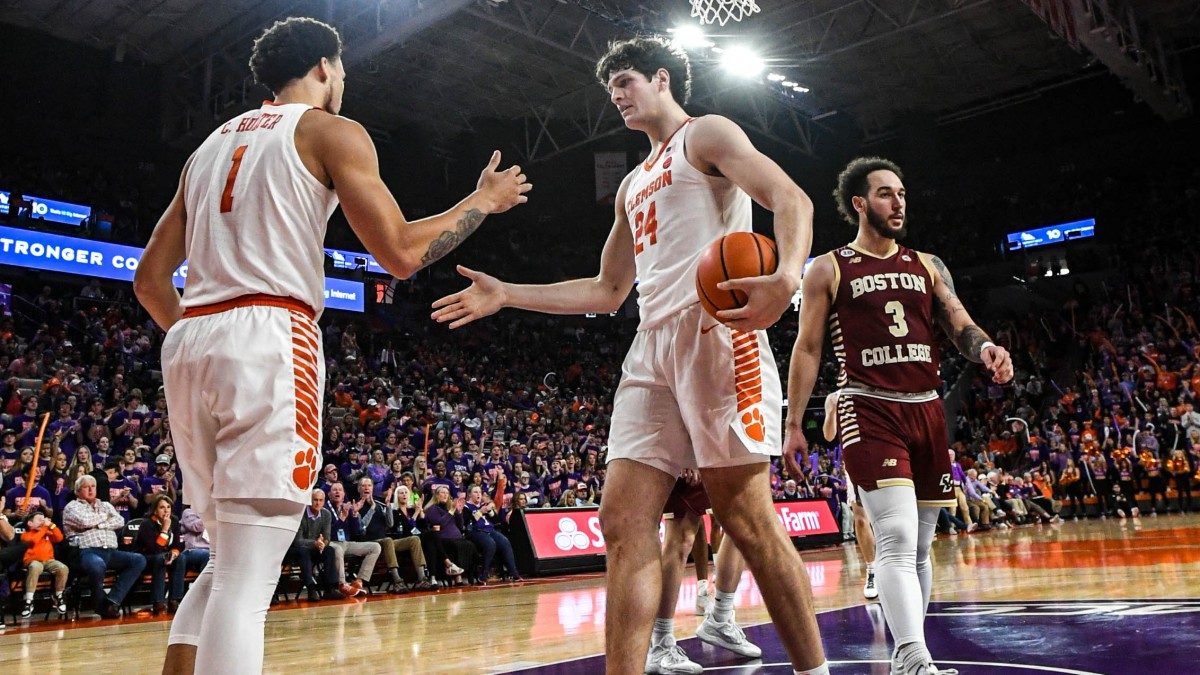 Clemson Tigers guard Chase Hunter (1) celebrates with center PJ Hall (24) as Boston College Eagles guard Jaeden Zackery (3) looks on during the second half at Littlejohn Coliseum.