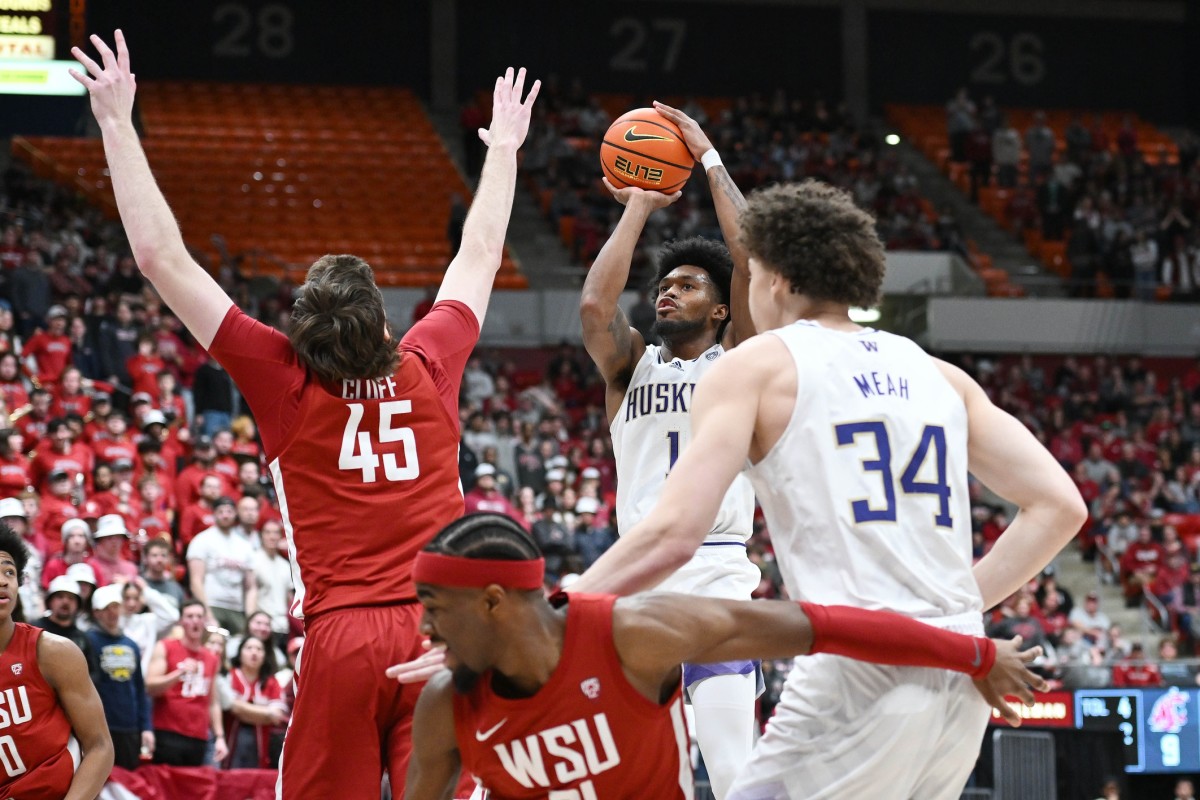 Keion Brooks lets fly with a jumper against Washington State.