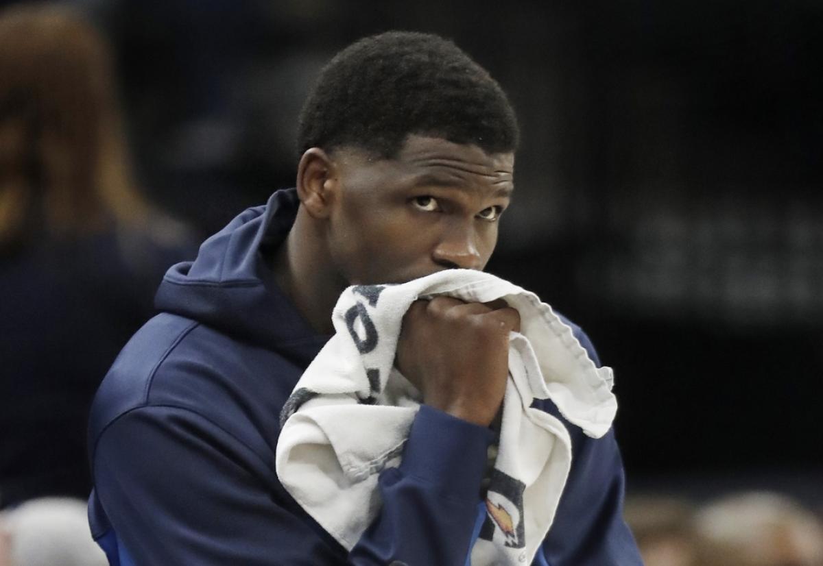 Feb 28, 2024; Minneapolis, Minnesota, USA; Minnesota Timberwolves guard Anthony Edwards (5) awaits his turn to return to the game against the Memphis Grizzlies in the fourth quarter at Target Center.