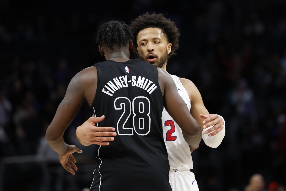  Detroit Pistons guard Cade Cunningham (2) and Brooklyn Nets forward Dorian Finney-Smith (28) hug after the game 