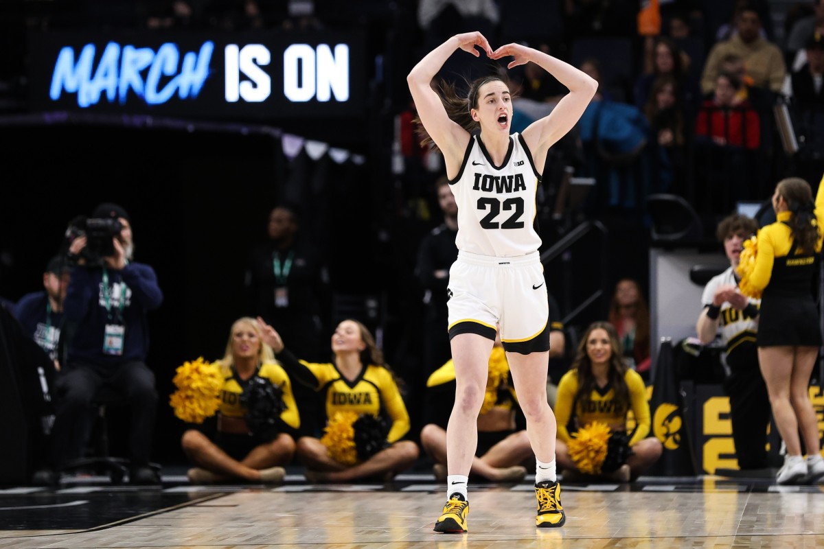 Iowa guard Caitlin Clark (22) reacts to the crowd during the first half against Maryland at Target Center in Minneapolis on March 4, 2023.
