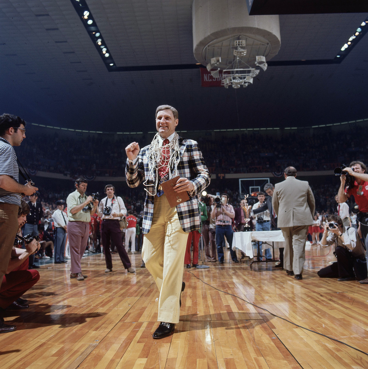 NC State coach Norm Sloan celebrates after beating Maryland in the 1974 ACC tournament final.