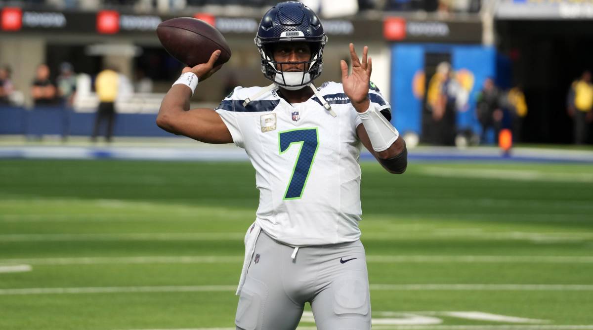 Seahawks quarterback Geno Smith throws a pass in warmups before a game.