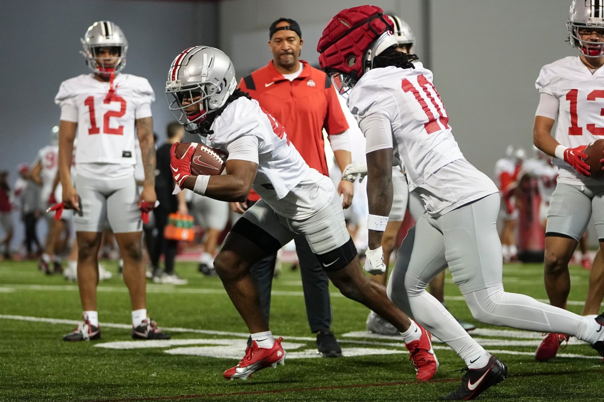 Mar 7, 2024; Columbus, OH, USA; Ohio State Buckeyes cornerback Diante Griffin (43) runs past cornerback Denzel Burke (10) during spring football practice at the Woody Hayes Athletic Center.