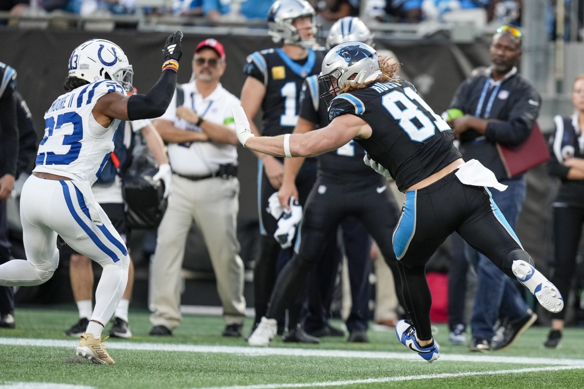 Carolina Panthers tight end Hayden Hurst (81) tries to stiff arm Indianapolis Colts cornerback Kenny Moore II (23). Mandatory Credit: Jim Dedmon-USA TODAY Sports