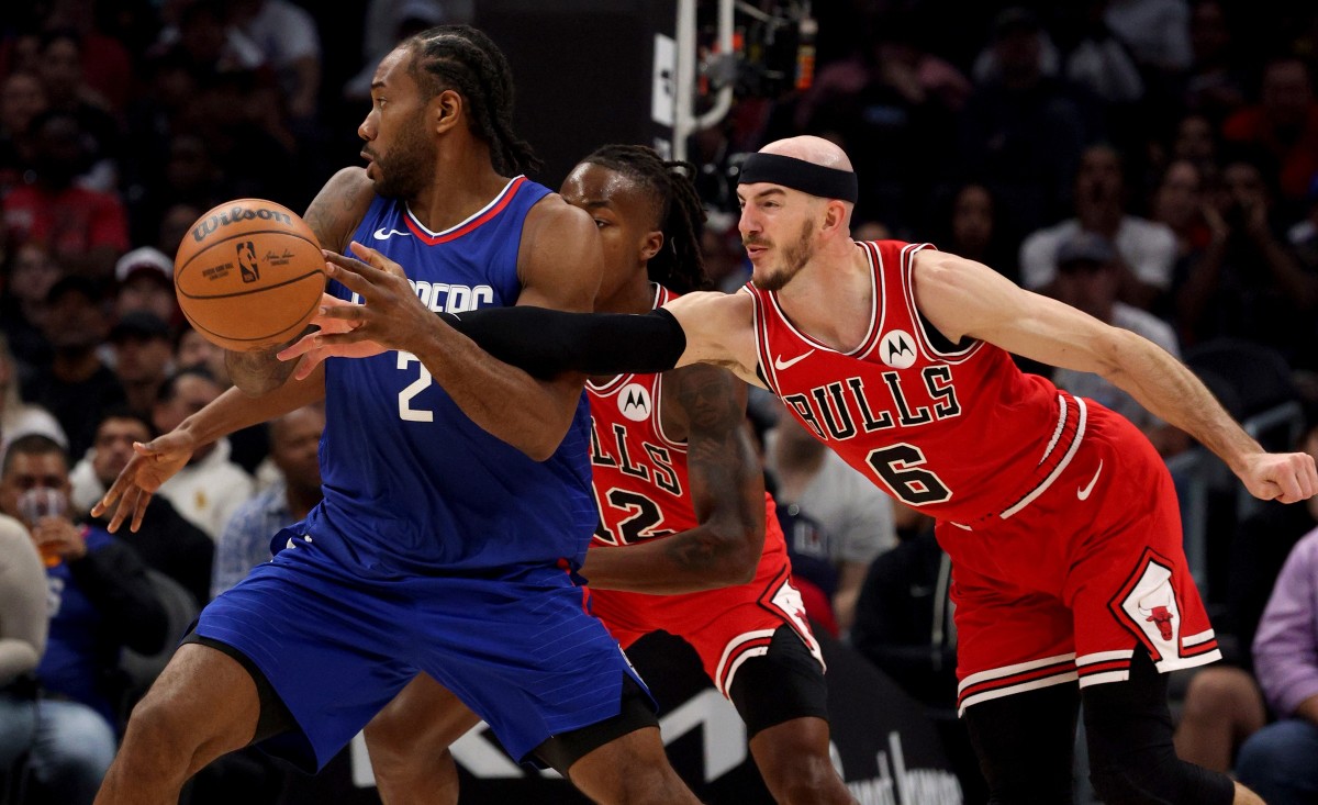  Chicago Bulls guard Alex Caruso (6) knocks the ball away from LA Clippers forward Kawhi Leonard (2) during the second quarter at Crypto.com Arena. 