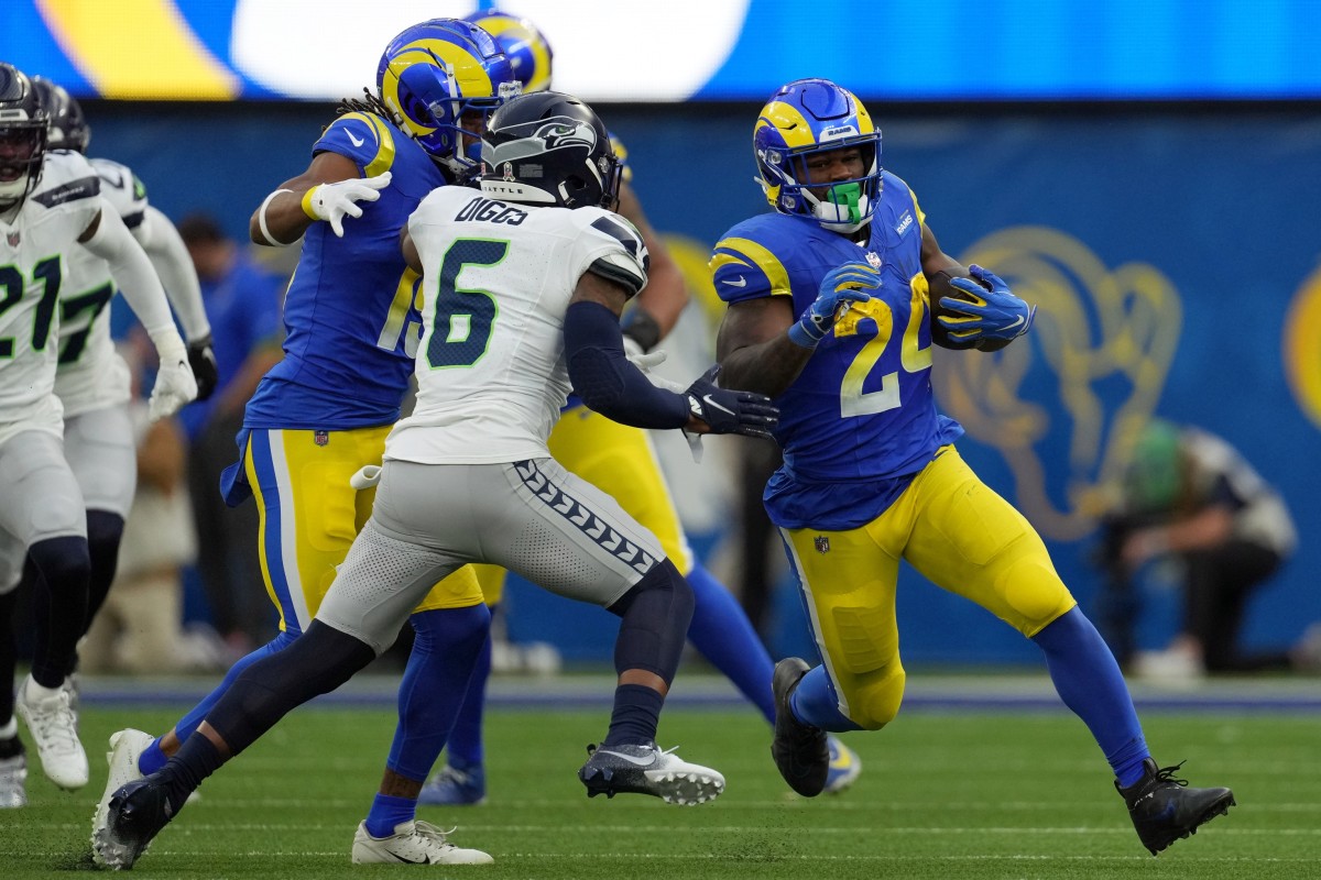 Los Angeles Rams running back Royce Freeman (24) runs against Seattle Seahawks safety Quandre Diggs (6). Mandatory Credit: Kirby Lee-USA TODAY Sports